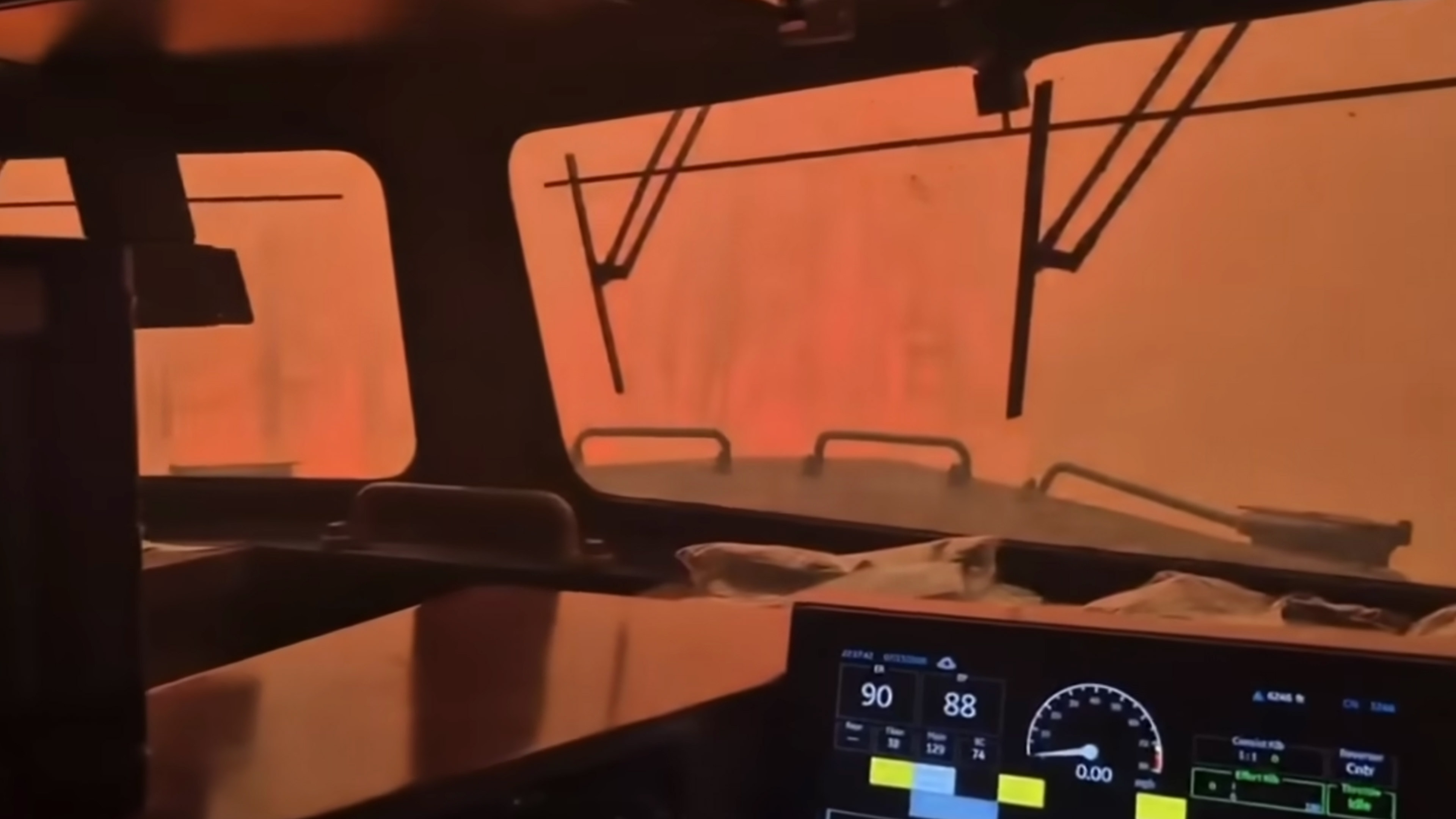 Dramatic video shows wildfire surround freight train in Canada